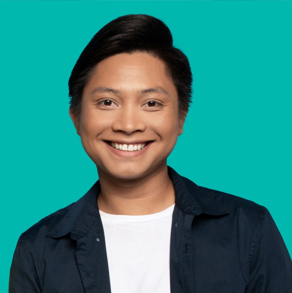 a man smiling at the camera